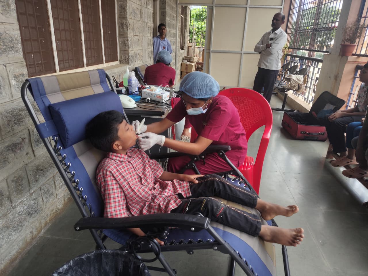 Student receiving dental treatment in a mobile dental unit on Day 1